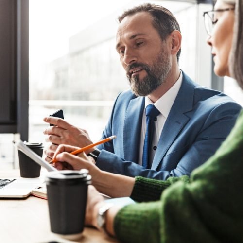 photo-of-colleagues-talking-while-working-with-lap-2025-02-15-12-08-18-utc (Large)